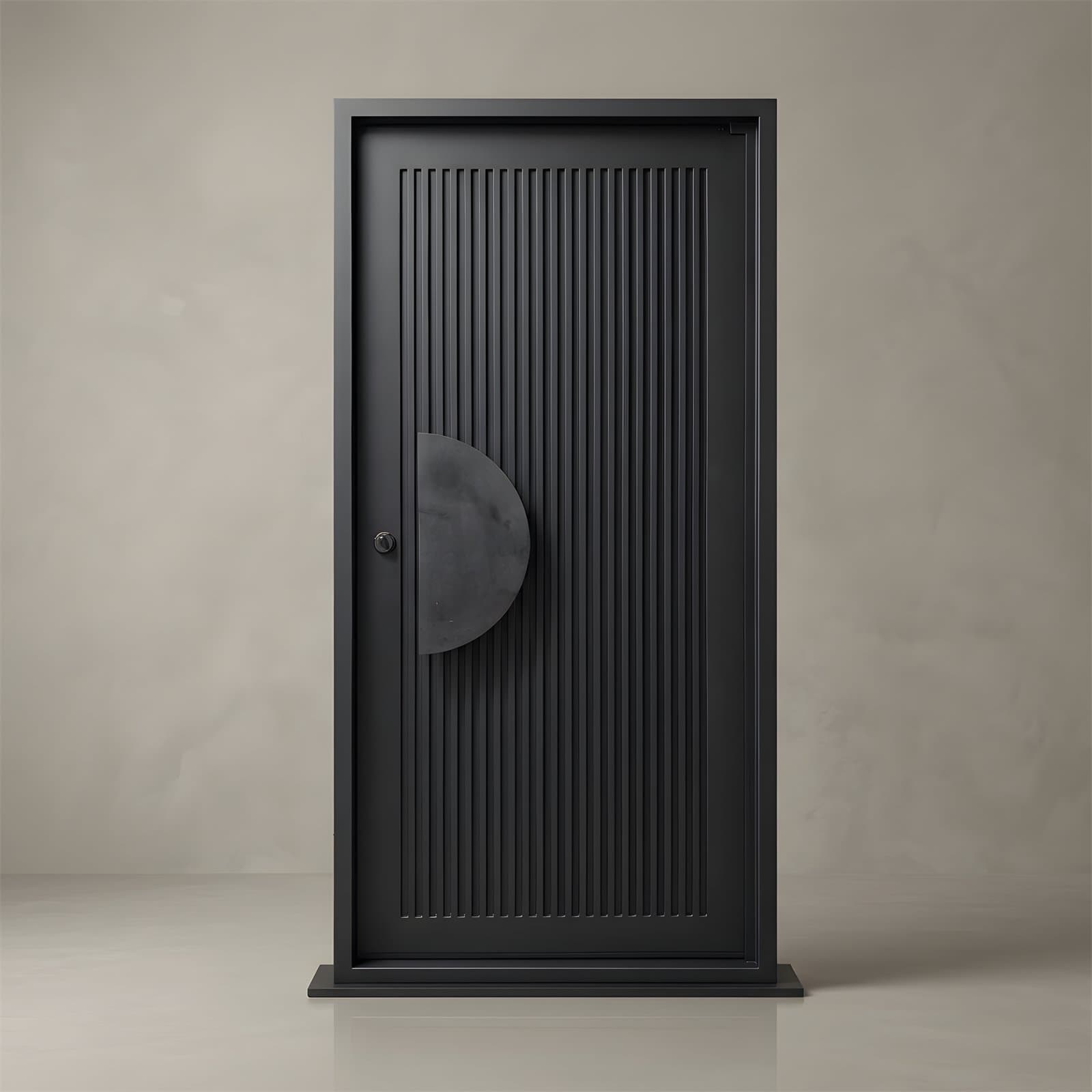 A finished matte-black wrought-iron door standing alone in the studio, fluted panel and half-round pull, lit against a plaster wall
